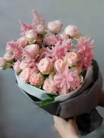 Bouquet of astilbe with roses and peonies