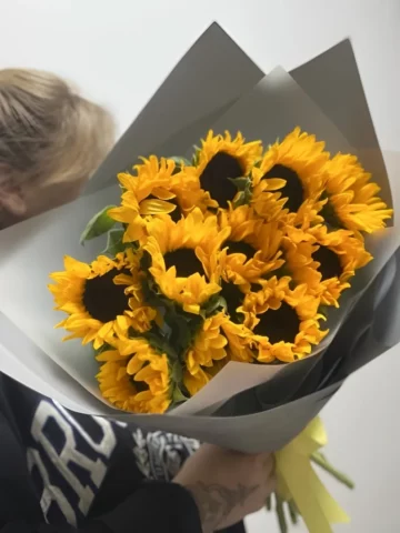 A bouquet of sunflowers in paper.